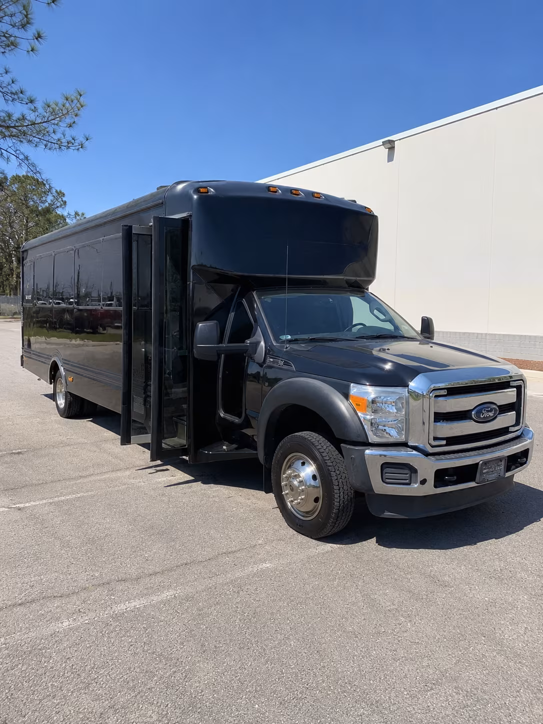 Friends laughing during a party bus celebration in Corona
