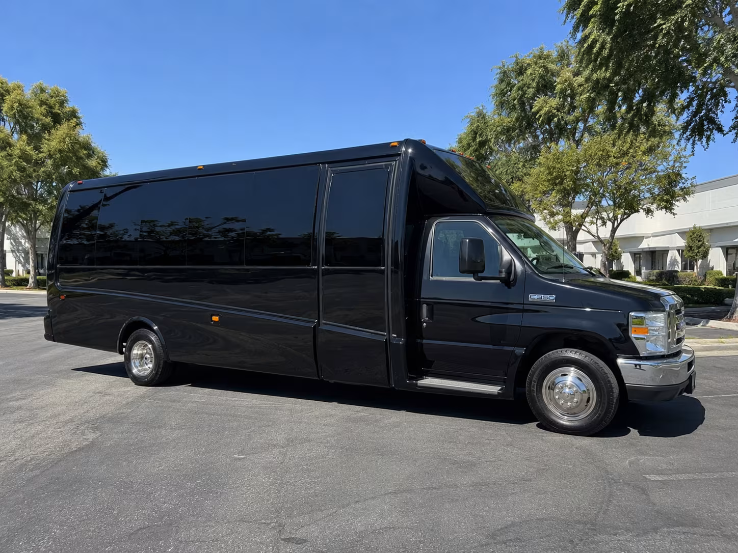 Wedding guests seated inside a party bus serving Corona